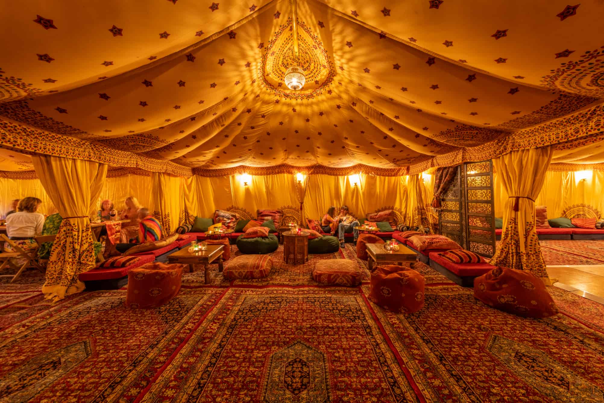 Inside an Arabian tent with low seating