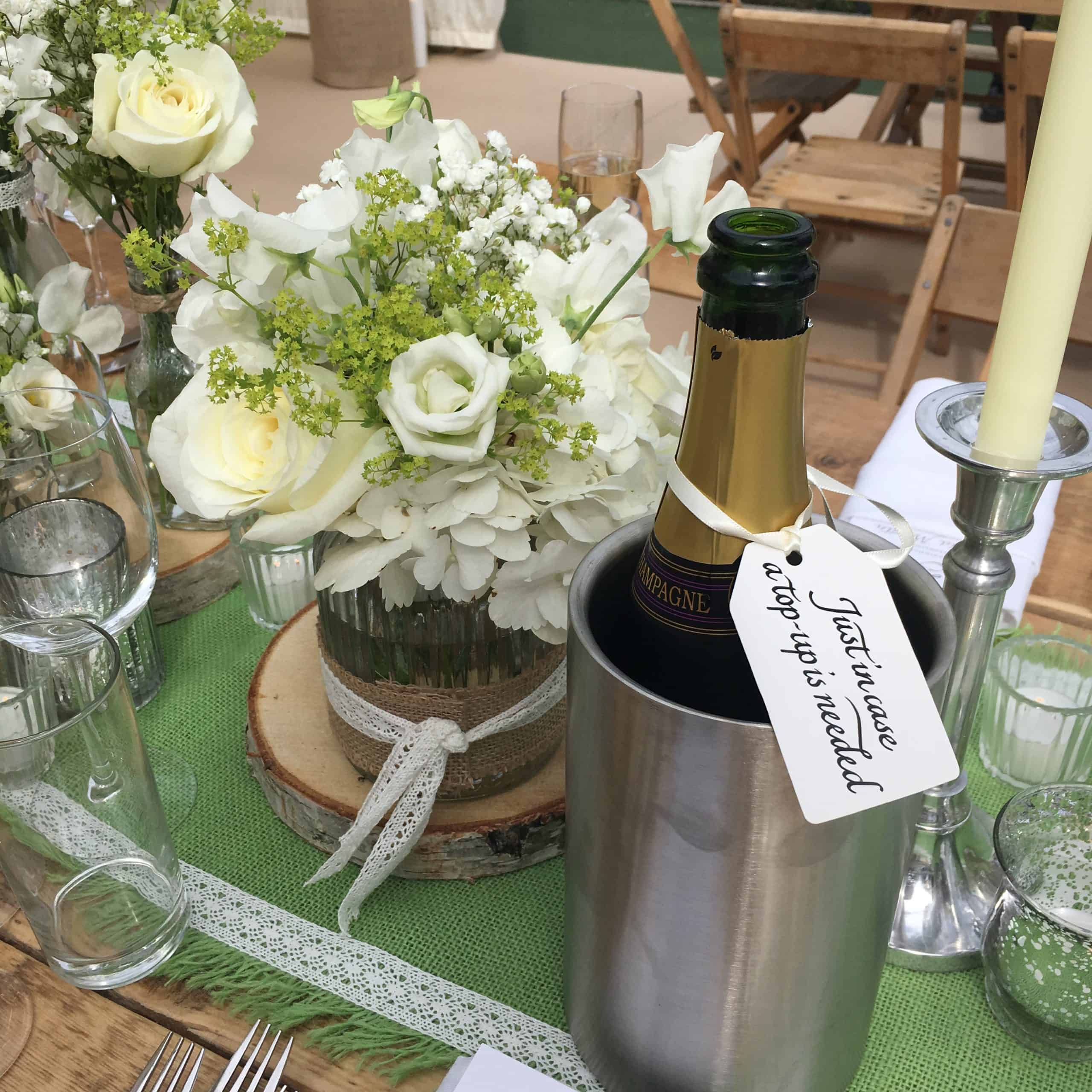 Beautiful Bristol Back Garden Wedding - white flower centrepiece and champagne