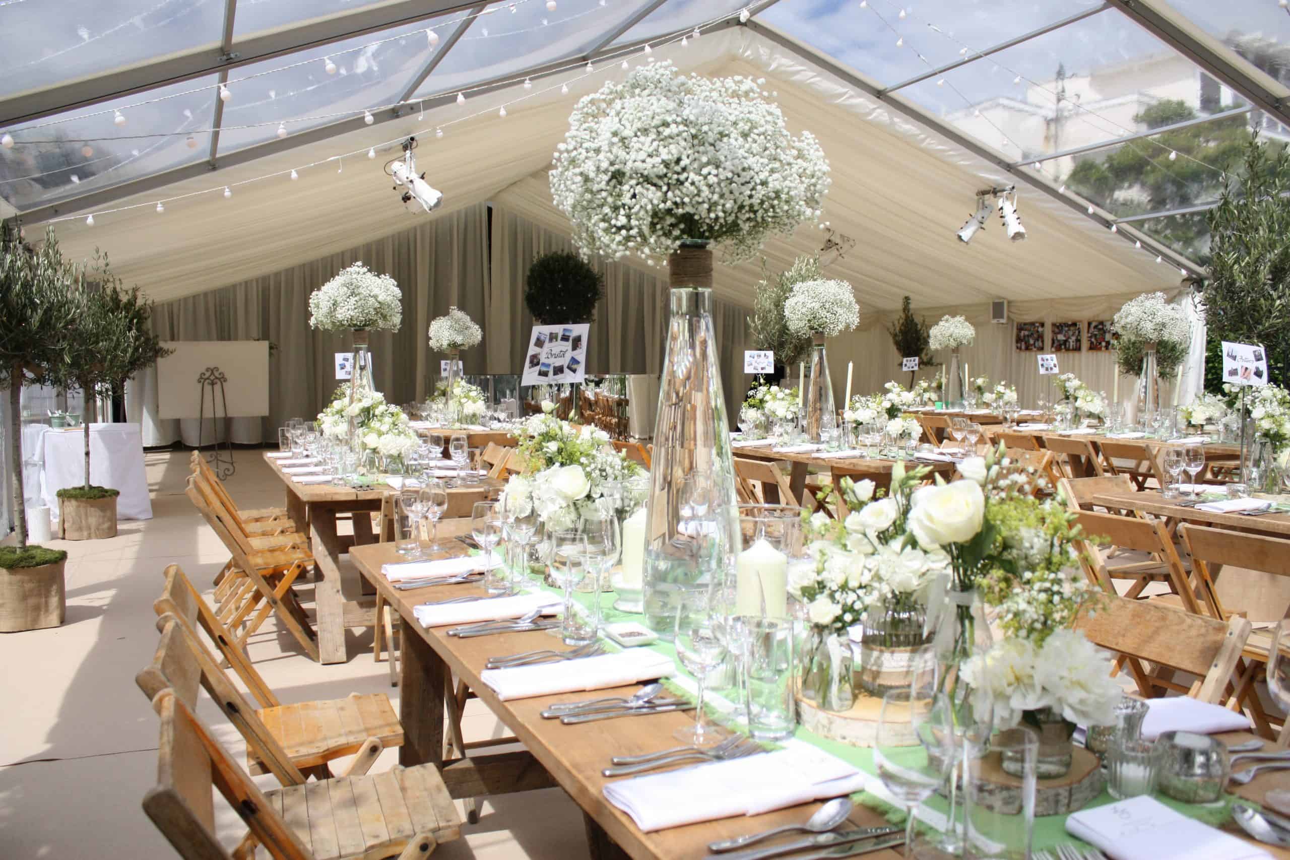 Beautiful Bristol Back Garden Wedding - rustic tables and white floral centrepieces in marquee